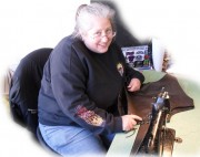 Marlene pretending to be hard at work. Check out Mac and Marlene's set up next to Humprey's Jewelry store. Marlene is a professional sewer from Connecticut. If your jacket or vest is important to you then have her sew on your patch. She is the pro.