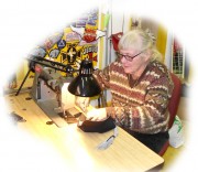Okay. Actually she was sewing the caps together. Another shot at Barbara's store