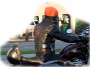 Biker riding his Harley on US-1. Check out the patches on his jacket and the leather face mask over his face. Has he robbed a Bank?