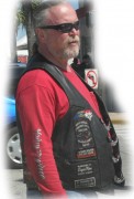 Here is a biker with some patches on his leather vest. Hope he surfs the web and buys his patches cheap from me