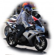 here is a Biker with a mohawk attached to his helmet riding on A1A Atlantic Avenue