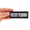 Patent Pending Funny Iron on Patch shown on hand for size comparison