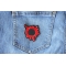 Bullet Hole Patch Blood Red shown on jeans