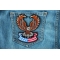 Brown Eagle Patch sitting on American Flag Patch for Jackets shown on jeans