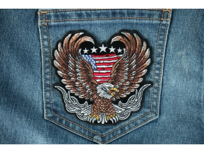 Up-winged biker eagle, with a portion of the American flag behind it