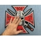 Maltese Cross Skull Knight Patch shown on hand for size comparison