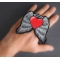 Guardian Angel Heart Patch shown on hand for size comparison