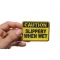 Caution Slippery When Wet Patch, Funny Patches for Adults shown on hand for size comparison