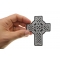 Celtic Design Cross Christian Patch shown on hand for size comparison