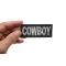 Cowboy Patch shown on hand for size comparison