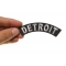 Detroit Patch shown on hand for size comparison