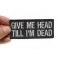 Give Me Head Till I'm Dead Funny Iron on Patch shown on hand for size comparison