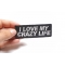I Love My Crazy Life Iron on Morale Patch shown on hand for size comparison