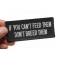 If You Can't Feed Them Don't Breed Them Iron on Morale Patch shown on hand for size comparison