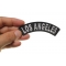 Los Angeles Patch shown on hand for size comparison