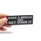 Make a Bridge and Get Over It Iron on Morale Patch shown on hand for size comparison