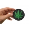 Marijuana Leaf Novelty Iron on Patch shown on hand for size comparison