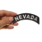 Nevada Patch Nevada Patch Iron on State Rocker shown on hand for size comparison