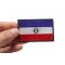 Paraguay Flag Patch shown on hand for size comparison