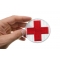Cross Medic Patch Medic Patch shown on hand for size comparison