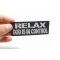 Relax God Is In Control Patch shown on hand for size comparison