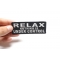 Relax Nothing Is Under Control Iron on Morale Patch shown on hand for size comparison