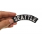 Seattle Patch shown on hand for size comparison