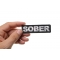 Sober Patch shown on hand for size comparison