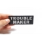 Trouble Maker Patch | Embroidered Patches Trouble Maker Funny Iron on Patch shown on hand for size comparison