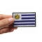 Uruguay Flag Patch shown on hand for size comparison