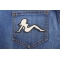 MudFlap Girl Patch In White Facing Right shown on jeans