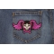Pigtails Bow Skull And Wings Small Pink Patch | Embroidered Patches Pigtails Skull and Wings Patch shown on jeans