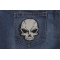 Reflective Small Cracked Skull Patch | Embroidered Patches Reflective Skull Patch shown on jeans