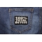 100 Percent Total Bitch Patch shown on jeans