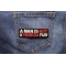 A Man Is Not A Financial Plan Funny Saying Patch shown on jeans
