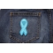 Blue Ribbon Patch For Awareness In Child Abuse And Bullying Blue Ribbon Patch For Awareness In Child Abuse and Bullying shown on jeans
