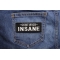 Certified INSANE Patch | Embroidered Patches Certified INSANE Funny Iron on Patch shown on jeans