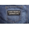 Cleverly Disguised As A Responsible Adult Patch shown on jeans