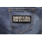 Danger Is Real Fear Is A Choice Patch shown on jeans