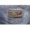 Dilligaf Patch 4 Inch Black Over Gray shown on jeans