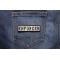 Enforcer Patch Black On White shown on jeans
