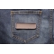 Gray Name Tag Blank Patch shown on jeans