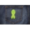 Green Ribbon Patch For Environmental Awareness shown on jeans