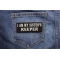 I Am My Sister's Keeper Patch In Black And White | Embroidered Patches I Am My Sister's Keeper Patch shown on jeans