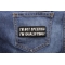 I'm Not Speeding I'm Qualifying Patch shown on jeans
