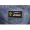 In Memory Of Jesus Patch shown on jeans