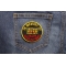 In Memory Of Vietnam Round Patch shown on jeans
