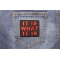 It Is What It Is Patch In Red | Embroidered Patches It Is What It Is Iron on Morale Patch In Red shown on jeans