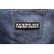 Kicking Ass Taking Names Patch shown on jeans
