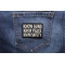 Know Guns Know Peace Know Safety Patch shown on jeans